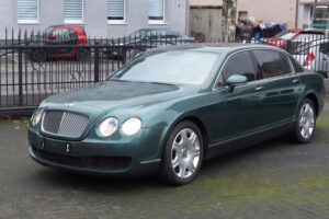 A used green Bentley Flying Spur.