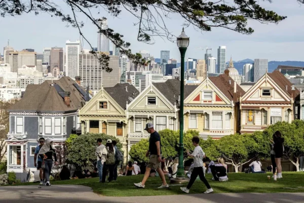 Visitors check out Alamo Square Park on Friday, an unseasonably warm winter day in San Francisco. (Stephen Lam/S.F. Chronicle)