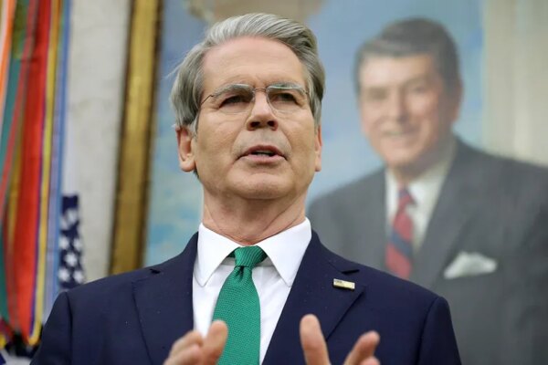 Treasury Secretary Scott Bessent in front of a Ronald Reagan portrait