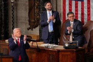 President Donald Trump, Vice President JD Vance and House Speaker Mike Johnson applaud during the State of the Union address in the House chamber at the U.S. Capitol in Washington, Feb. 24, 2026. (AP Photo/Mark Schiefelbein, File)