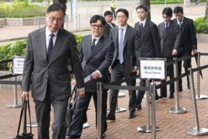 Victor Dawes SC, the independent committee’s lead counsel (left), arrives at City Gallery on the fifth session of the Wang Fuk Court fire hearing. Photo: Jelly Tse