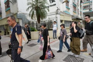 Residents leave prayers and flowers on third day of return to Wang Fuk Court