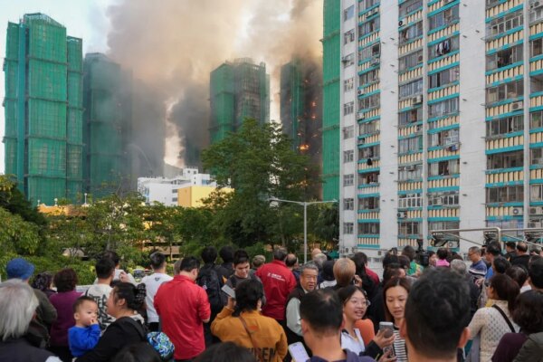 Tai Po fire survivors mourn heroine who alerted neighbours to flames
