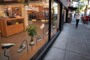 A pedestrian wearing a protective mask walks past an Allbirds Inc. store in San Francisco, California, U.S., on Wednesday, Feb. 17, 2021. The U.S. economy started 2021 with a bang as retail sales and factory output accelerated and expectations continue to build for another jolt of government stimulus, setting the stage for what could be the best year of economic growth in nearly four decades. Photographer: David Paul Morris/Bloomberg via Getty Images