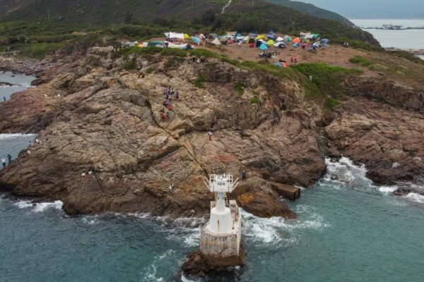Woman rescued after falling into sea while taking photos at a Hong Kong lighthouse