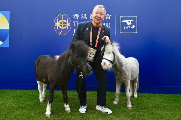 Club Chief Executive Officer Winfried Engelbrecht-Bresges at Jockey Club booth with  Shetland ponies.
