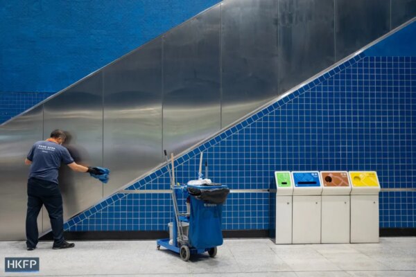 Luke Ching working as a transit cleaner at Tai Wai train station on March 31, 2023. Photo: Kyle Lam/HKFP.
