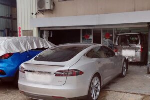 Teen driving Tesla arrested after knocking second vehicle through storefront
