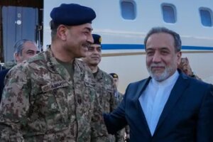 Iranian Foreign Minister Abbas Araqchi welcomes Pakistan army chief Asim Munir at an airport in Tehran, Iran, April 15, 2026. (Reuters)