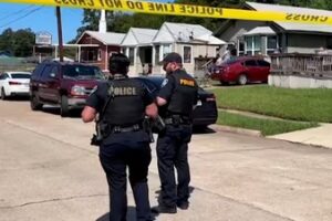Police officers secure a street where eight children, with ages ranging from 1 to 14, were killed in a mass shooting in Shreveport, Louisiana. (via REUTERS)