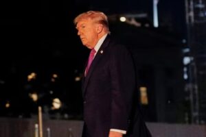 U.S. President Donald Trump walks after exiting Marine One on the South Lawn while returning to the White House in Washington. (REUTERS)