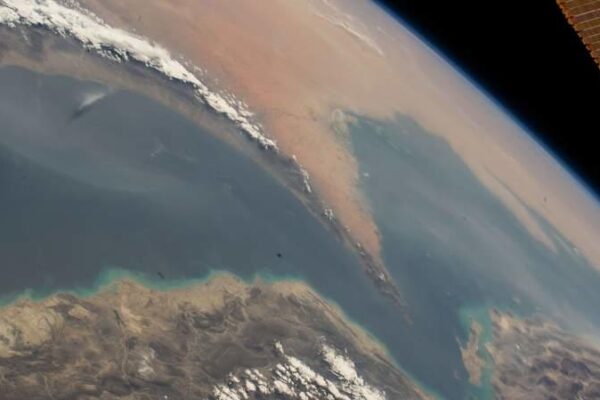 A satellite image, captured by NASA, shows the Strait of Hormuz, which connects the Gulf of Oman (L) with the Persian Gulf (R) and separates Iran (below) from the countries of the Arabian Peninsula—Oman, the United Arab Emirates, and Qatar. -/Nasa/dpa