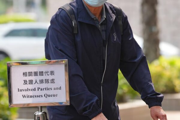 Law Kwok-shui, an electrician of ISS EastPoint, heads into the hearing. Photo: Karma Lo