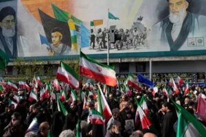 Mourners carry Iranian flags in Tehran on April 1, 2026 during a funeral procession for Alireza Tangsiri, head of Iran's Islamic Revolutionary Guard Corps Navy, and others killed in Israeli strikes (AP)