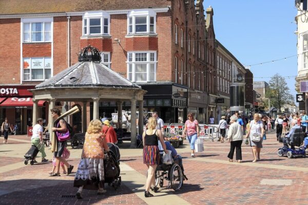 People walk the street in Worthing