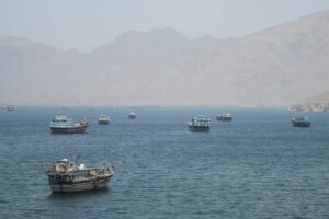 Boats in a bay with mountains in the background.