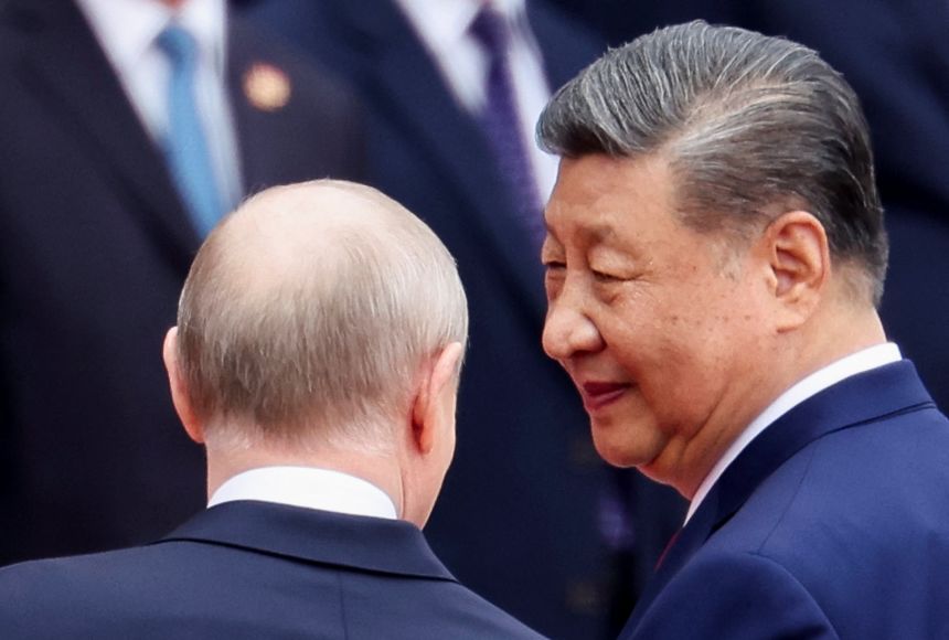 Russian President Vladimir Putin and Chinese President Xi Jinping attend a welcoming ceremony at the Great Hall of the People in Beijing, China May 20, 2026.