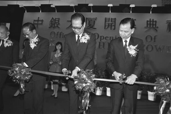 Mr Wang Deyan (second from left), President of the Bank of China, and Mr Zhou Nan (centre), Director of the New China News Agency, perform the ribbon-cutting ceremony which marks the opening of the Bank of China Tower in 1990. Photo: SCMP