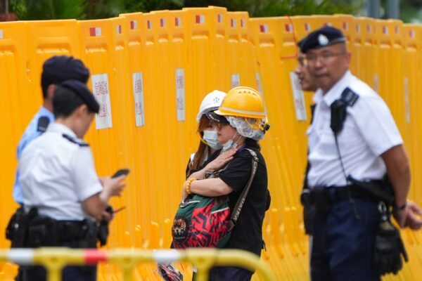 A social worker comforts a resident on Monday. Photo: Eugene Lee