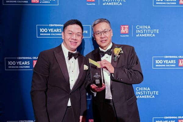 Andy Tung (right) shows off the award he received on behalf of his father with James Chau, president of the China-United States Exchange Foundation. Photo: CUSEF