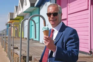 Reform UK leader Nigel Farage eats an ice cream after after casting his vote in the local elections in Walton-on-the-Naze, Essex. Picture date: Thursday May 7, 2026. PA Photo. Photo credit should read: Joe Giddens/PA Wire