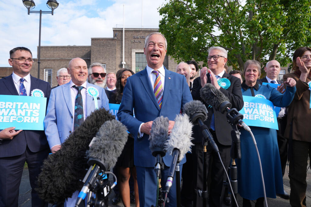 Reform UK leader Nigel Farage speaks to the media during a visit to Havering Town Hall, in Romford, England, Friday May 8, 2026, a day after the local elections.