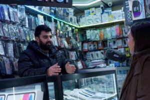 Undercover BBC footage captured inside Afg Mobile Repair in Woolwich, south-east London, during an investigation into alleged payments linked to illegal Channel crossings. Credit: BBC Local Investigations