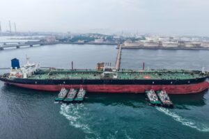 A cargo ship unloads imported crude oil at the Qingdao crude oil terminal in Chinas eastern Shandong province. (AFP)