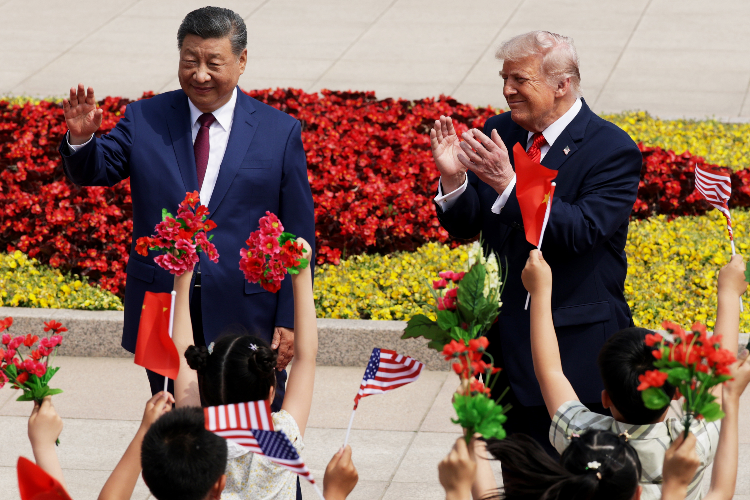 Chinese President Xi Jinping and U.S. President Donald Trump attend a welcome ceremony at the Great Hall of the People on Thursday in Beijing. Credit: Alex Wong/Getty Images