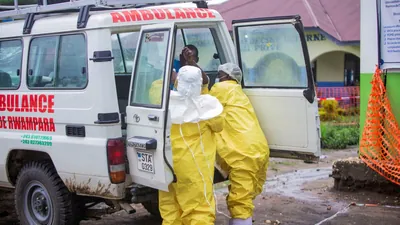 The dangerous work of burying suspected victims is being managed wherever possible by authorities. (REUTERS)