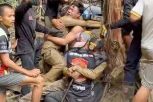 Rescue operations will continue as two men remain trapped in a semi-submerged cave (AFP)