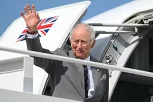 Britain's King Charles III waves as he boards his plane at Joint Base Andrews in Maryland (Reuters)