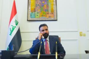 New Iraqi Prime Minister designate Ali al-Zaidi, uses a phone at his office in Baghdad. (via REUTERS)