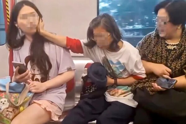 Elderly woman tries to shove younger one out of priority seating on MTR train