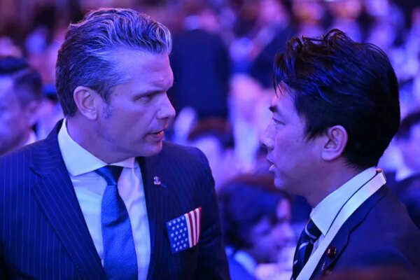 US Secretary of Defense Pete Hegseth (L) speaks with Japan's Defense Minister Shinjiro Koizumi during the 23rd Shangri-La Dialogue summit in Singapore on May 29, 2026. (Photo by JAM STA ROSA / AFP)