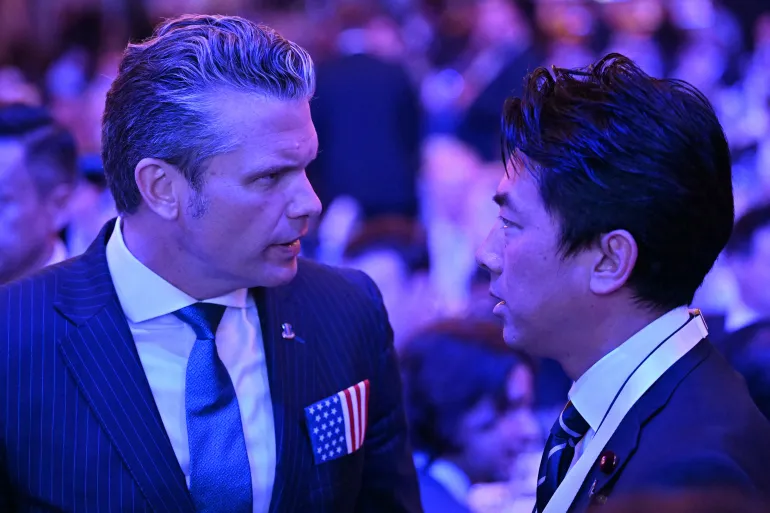 US Secretary of Defense Pete Hegseth (L) speaks with Japan's Defense Minister Shinjiro Koizumi during the 23rd Shangri-La Dialogue summit in Singapore on May 29, 2026. (Photo by JAM STA ROSA / AFP)
