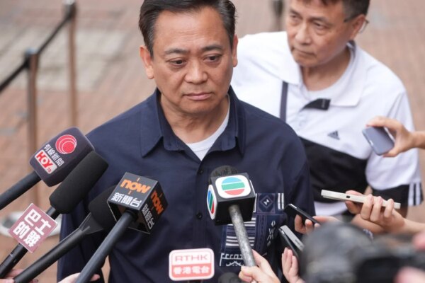 Former Wang Fuk Court representative and wife held over fraud, money laundering