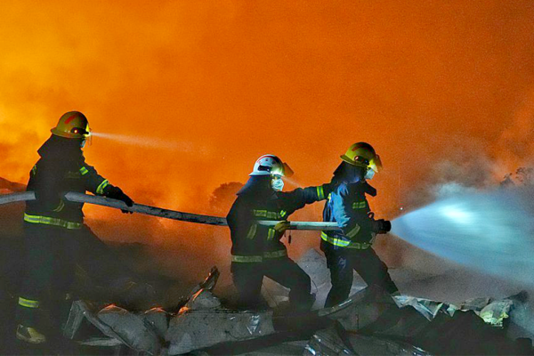 Fire crews work to put out a fire