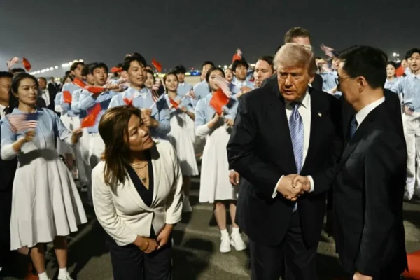 US President Donald Trump (C) is greeted by China's Vice President Han Zheng