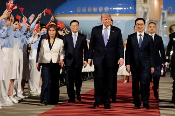 Trump with chinese vice president as he arrives in china