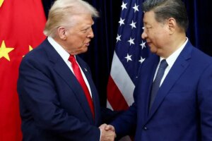 U.S. President Donald Trump shaking hands with Chinese President Xi Jinping at Gimhae International Airport