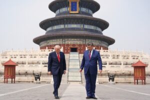 President Donald Trump, left, walks with Chinese President Xi Jinping at the Temple of Heaven on Thursday, May 14, 2026, in Beijing. (AP Photo/Mark Schiefelbein)