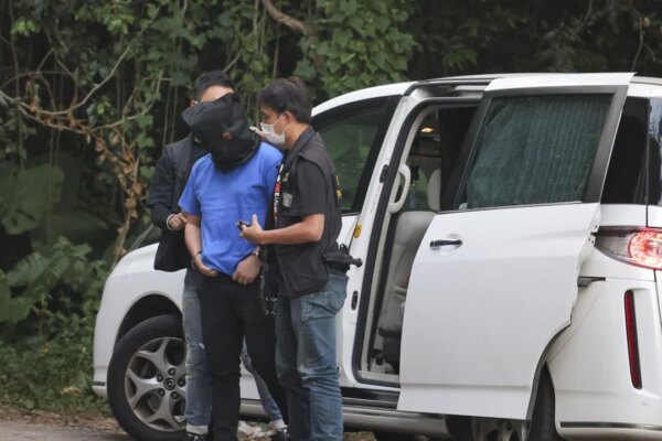 Life sentences for Hong Kong pair who suffocated man with tape in village temple