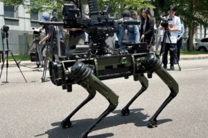 A gun is attached to the top of the machine