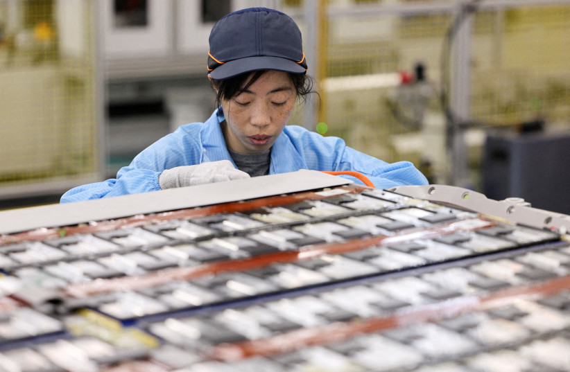 An employee works on a battery assembly line at the factory of Leapenergy, a unit of Leapmotor, during an organised media tour in Huzhou, Zhejiang province, China, April 26, 2026.