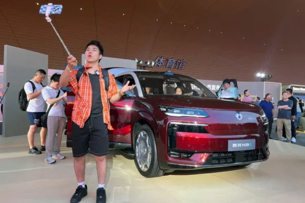 People check the newly launched N9 electric vehicle (EV) under BYD's premium brand Denza, displayed at a launch event in Guangzhou, Guangdong province, China May 18, 2026.