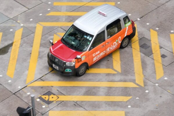 Chinese ride-hailing giants back Hong Kong plan to cap permits at 10,000
