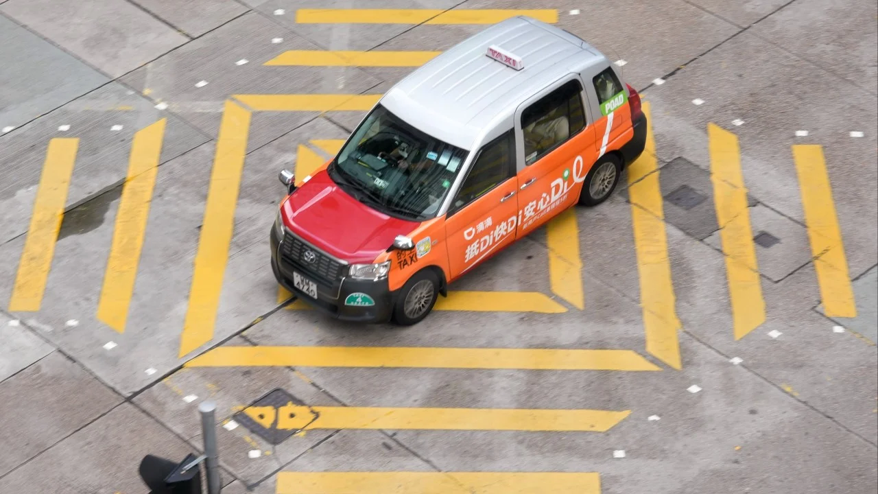 Chinese ride-hailing giants back Hong Kong plan to cap permits at 10,000