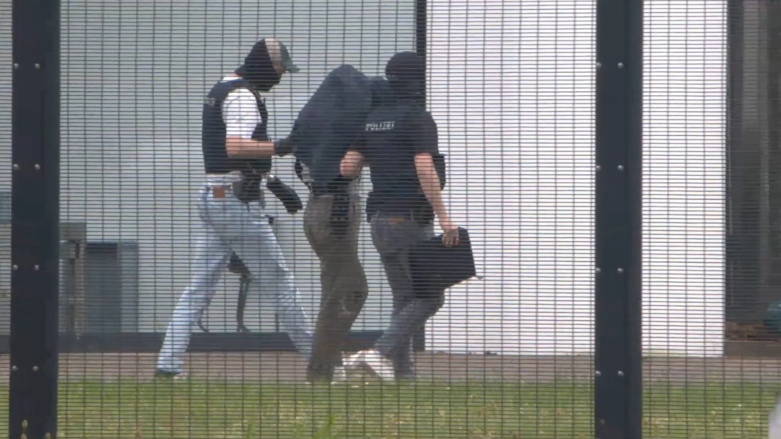 A man believed to be a suspected Chinese spy is taken to the Federal Court of Justice to be presented for arrest in Karlsruhe, Germany, on 20 May 2026.