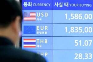 Foreign exchange rates are displayed on a screen at Incheon International Airport in Incheon, Tuesday. Yonhap